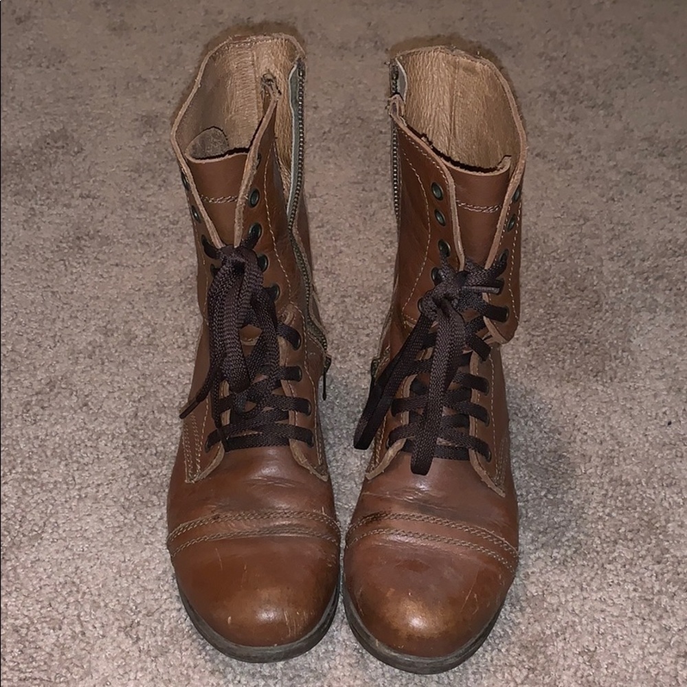 Brown lace up combat boots with zipper on inside